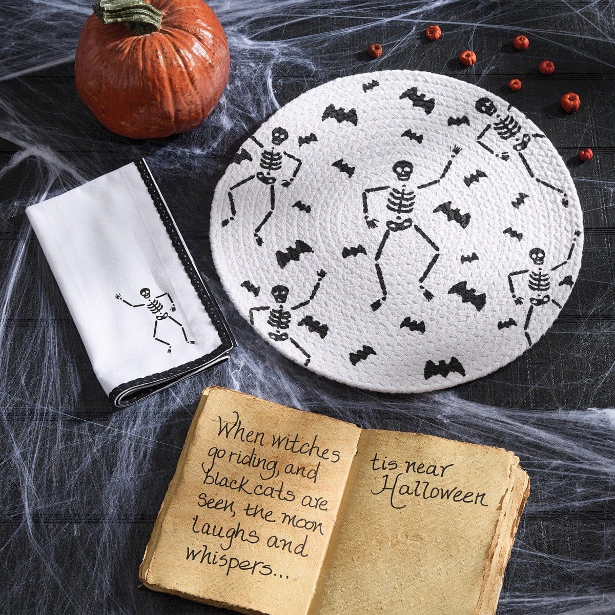 https://villagemerchant.com/cdn/shop/files/braided-skeleton-placemat-round-43371489624360_1600x.jpg?v=1700090950