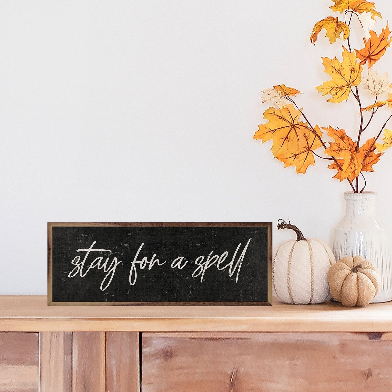 Kendrick Home Walnut Frames 12x4 Simple Stay For A Spell Black Printed and Framed Wall Sign