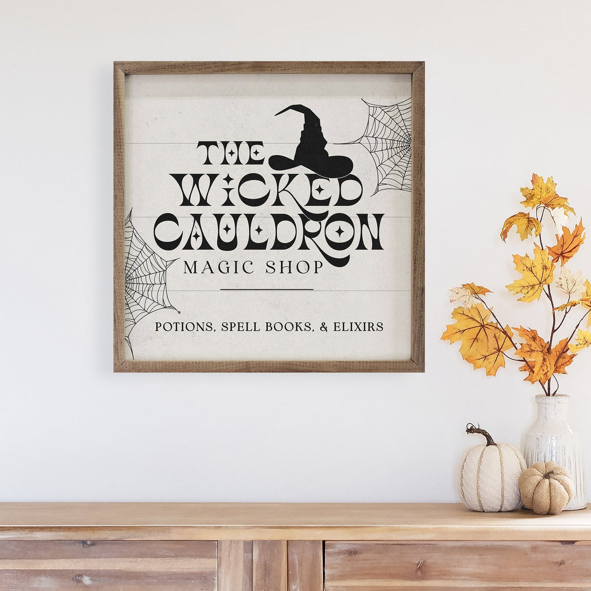 Kendrick Home Walnut Frames Wicked Cauldron Hat And Webs White Printed and Framed Wall Sign